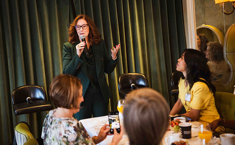 Carrie Ruddy speaking at Climate Week Tea Party Event